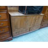 A light Ercol Windsor sideboard with thr