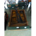 A tray containing cast metal post tops,