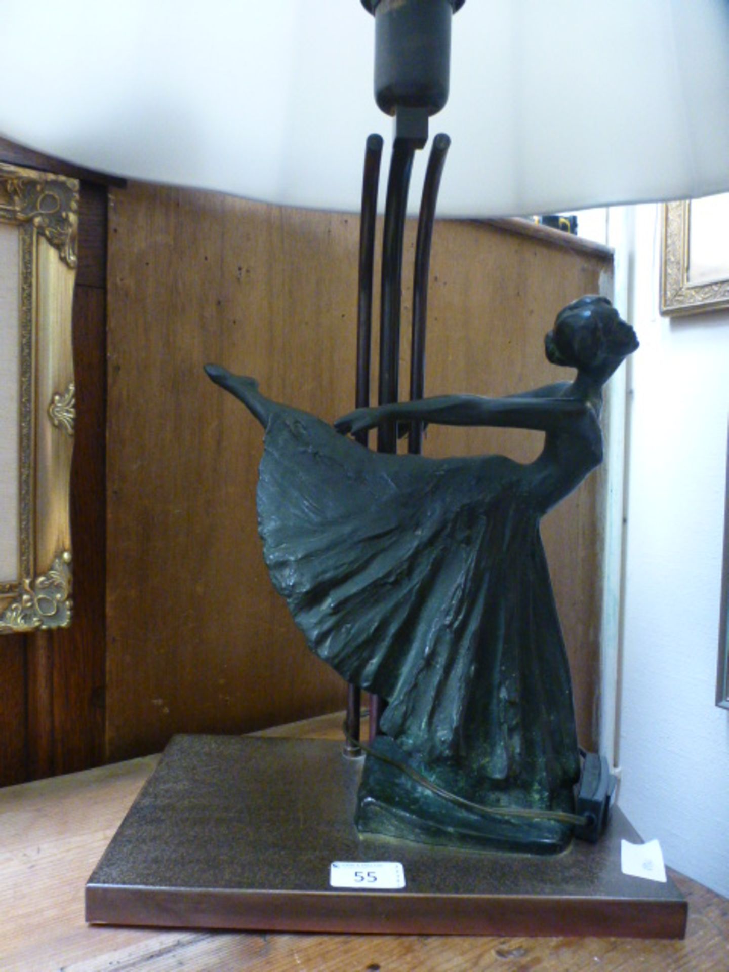 A table lamp with cast figure of balleri