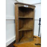 A waxed pine corner shelf unit