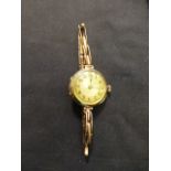 A 9ct gold cased ladies wristwatch on an