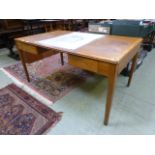 A mid-20th century oak desk with leather