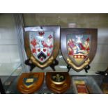 Two wooden shields with coat of arms tog