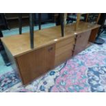 A teak sideboard having three drawers fl