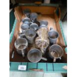 A tray containing mainly pewter tankards