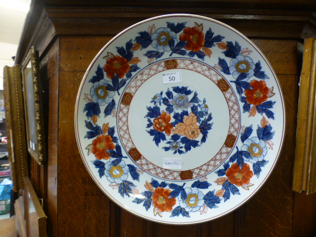 An oriental ceramic charger with floral