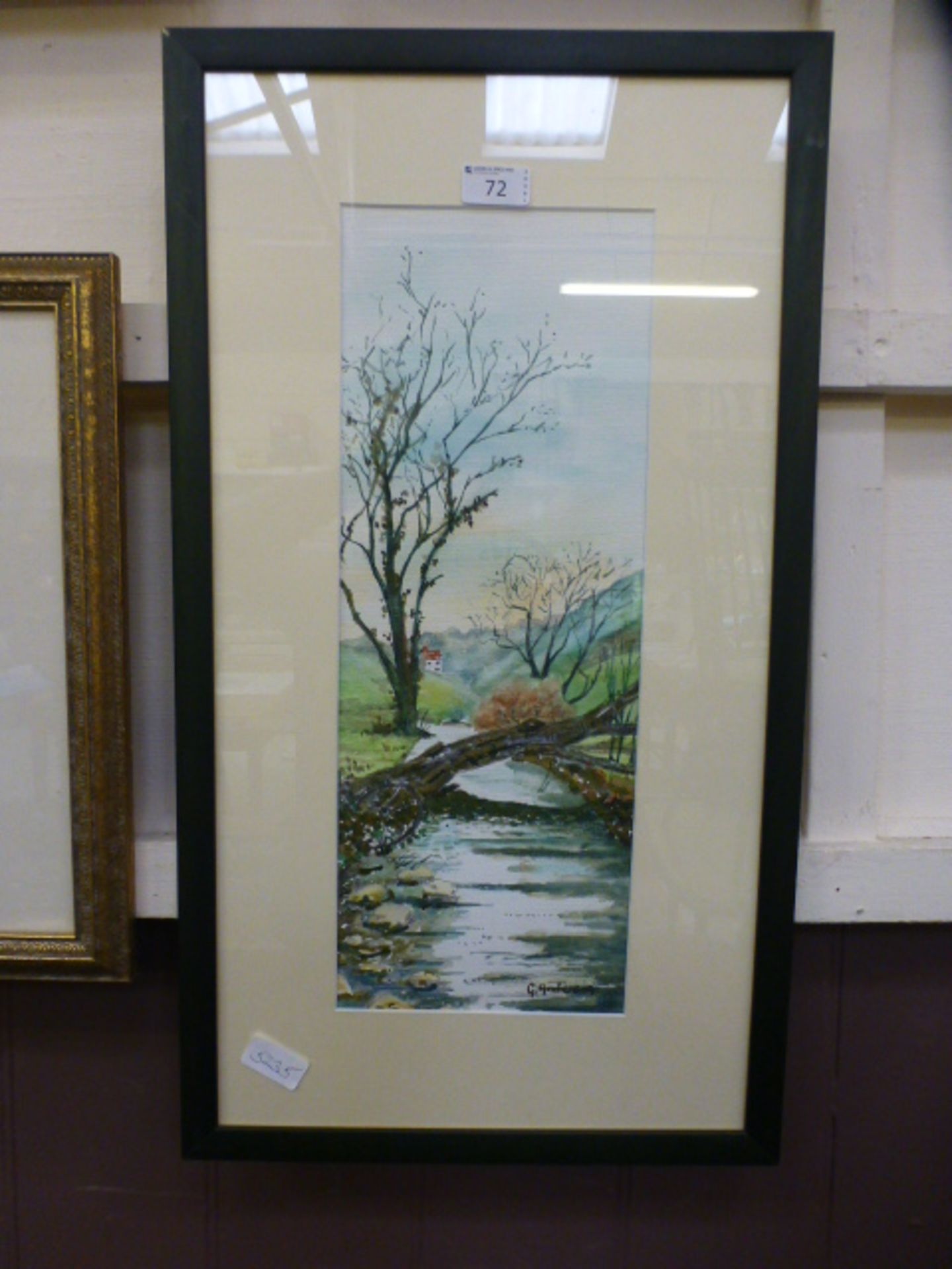 A framed and glazed watercolour of river