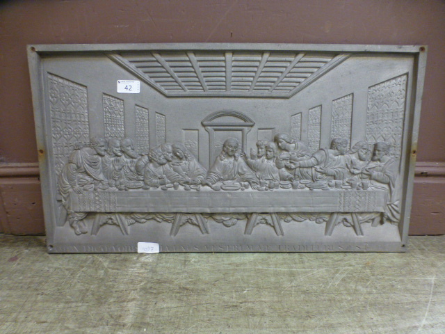 A cast metal plaque depicting 'The Last