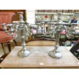 A pair of metal candelabra