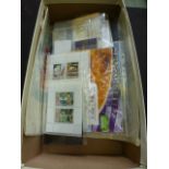 A box containing an assortment of stamps