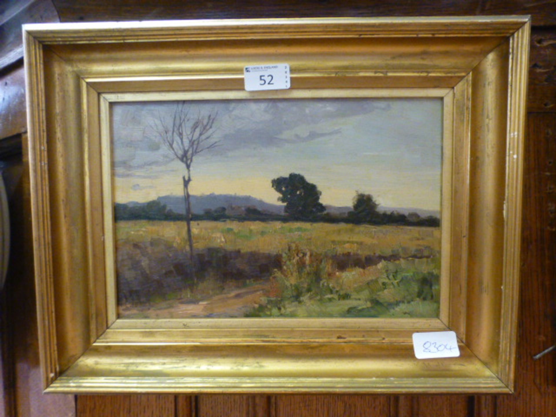 A gilt framed oil on board of countrysid