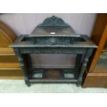 A late 19th century carved oak hall stan