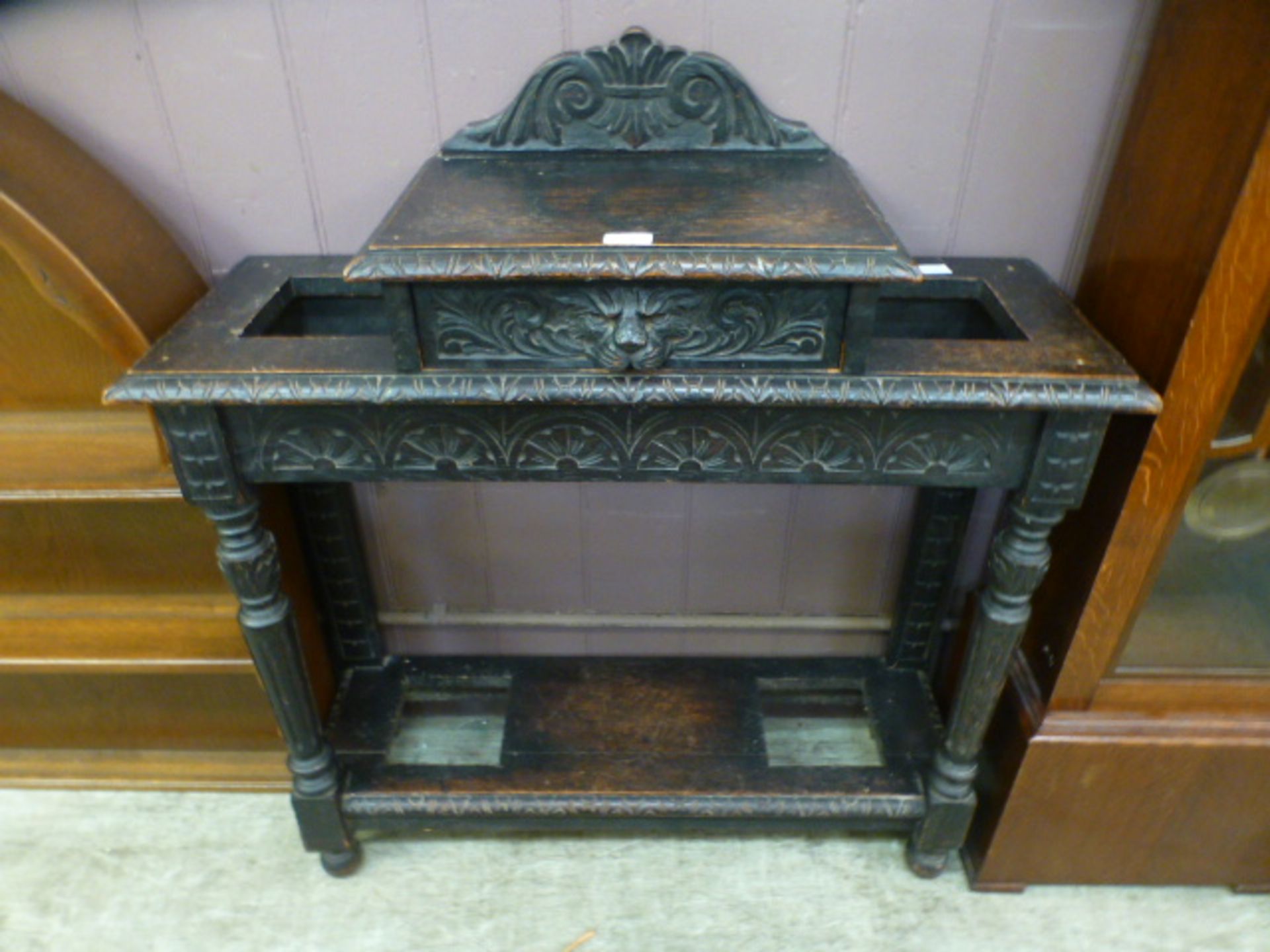 A late 19th century carved oak hall stan