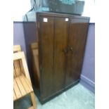 A mid-20th century two door wardrobe