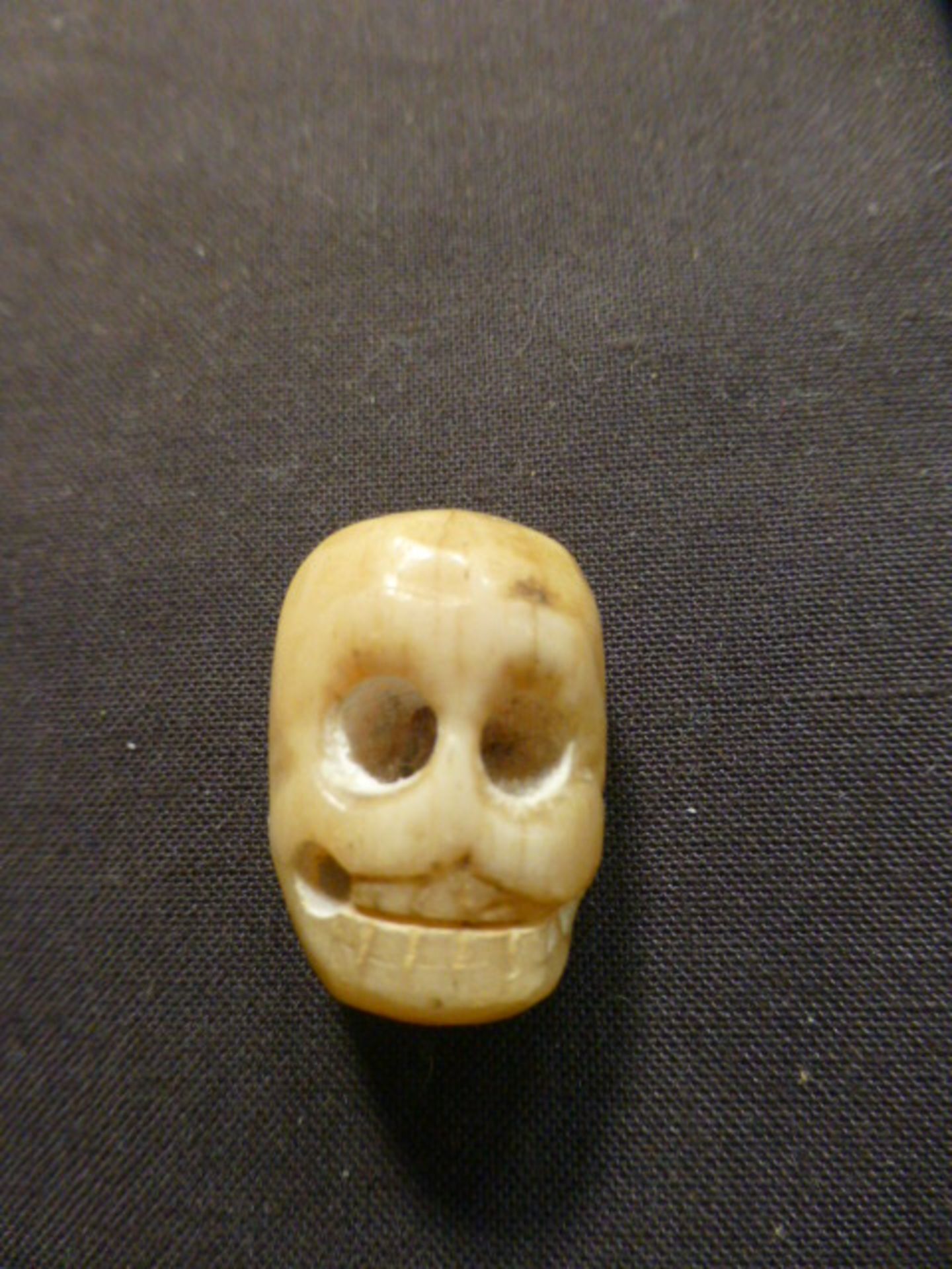 A carved bone memento mori