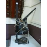 An old electric pillar drill on stand