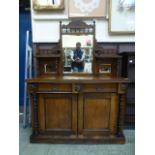 An Edwardian walnut side cabinet, the su