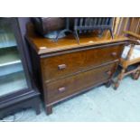 An early 20th century oak two drawer che