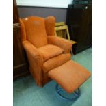 A modern wingback armchair and matching