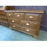 A waxed pine chest of three short over t