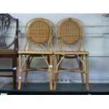 A pair of bamboo and wicker single chair