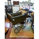 An early 20th century doll's pram by Hal