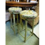 A pair of green painted stools