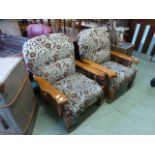 A pair of pine framed armchairs upholste