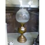 A 19th century brass oil lamp having a g