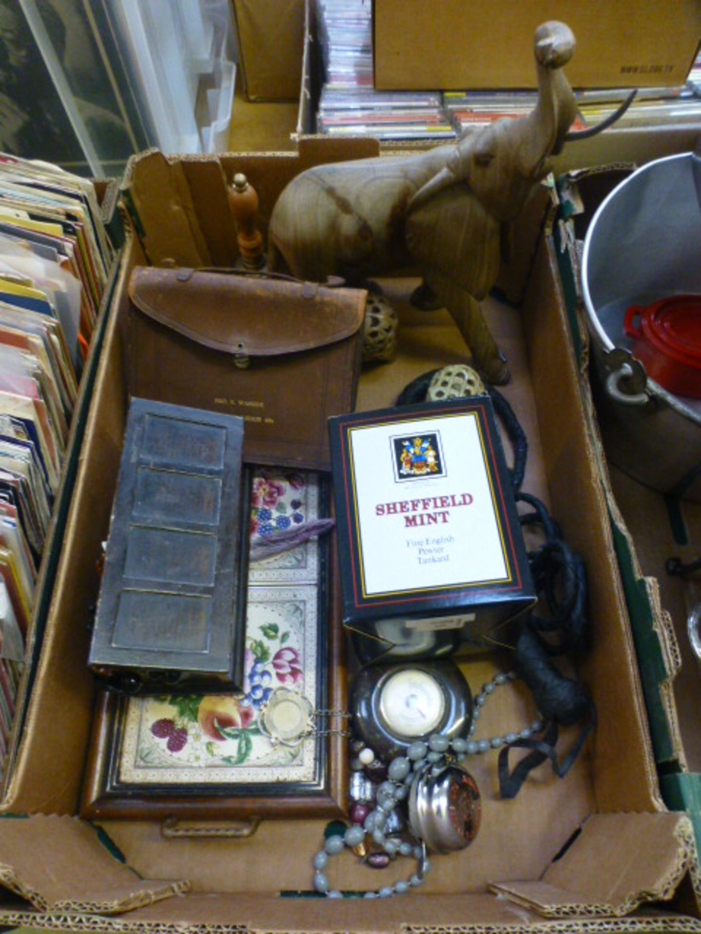 A tray containing model elephants, treen