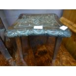 A 19th century carved oak stool on later