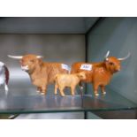 A family of Beswick Highland cattle