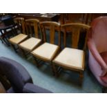 A set on four oak framed dining chairs