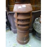A terra cotta chimney pot