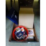 A box containing collectors plates, silk