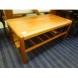 A mid-20th century teak coffee table wit