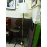 A modern brass effect standard lamp