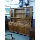 A modern pine dresser, the top with open