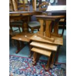 A nest of three oak occasional tables al