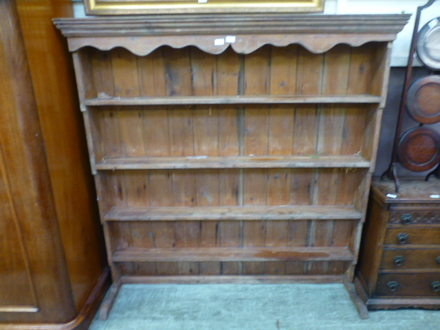 A 19th century pine plate rack