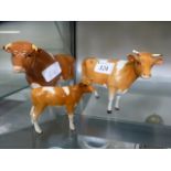 A family of Beswick cattle