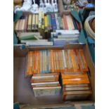 Two trays of hard and soft back books to