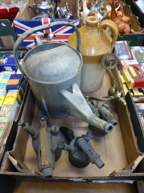 A tray containing blowtorches, watering