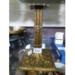 A brass Corinthian column style candlest