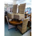 A set of six wicker dining chairs