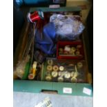 A tray containing sewing and knitting re