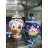 Two Chinese style lidded baluster vases