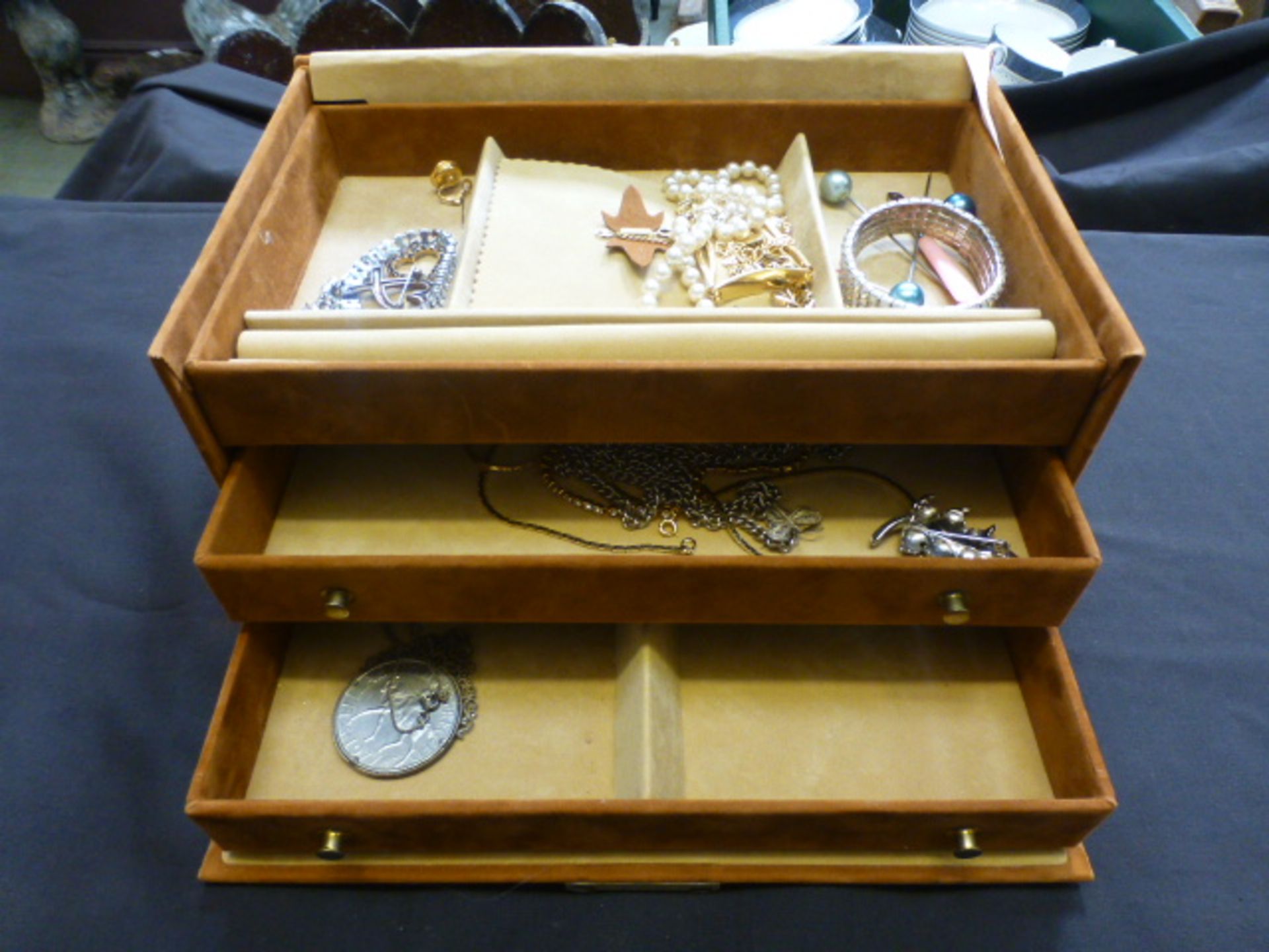 A jewellery box containing an assortment