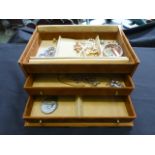 A jewellery box containing an assortment