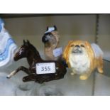 A Beswick model of a foal together with